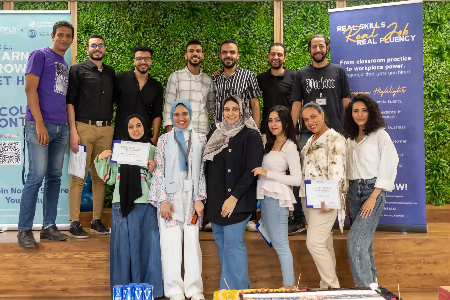 Octopus Academy graduates holding their certificates