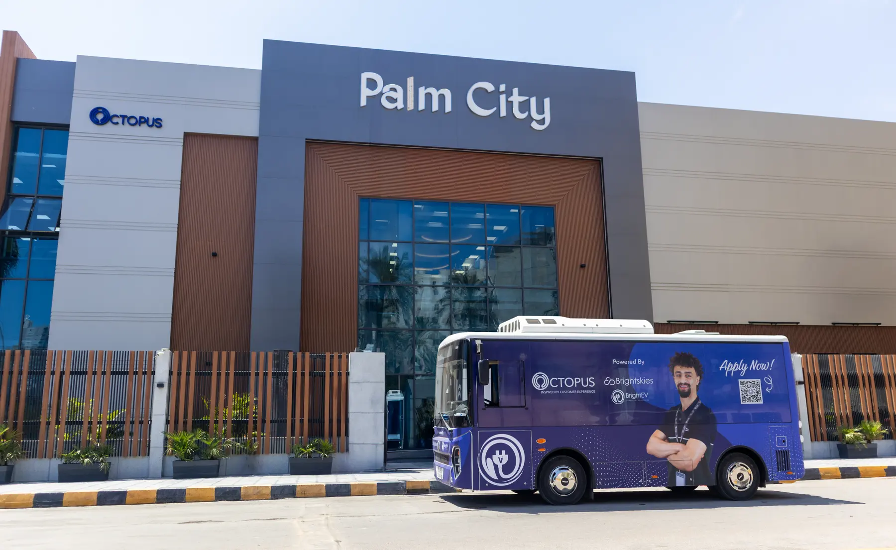 The Palm City building in Alexandria with an Octopus electric bus outside