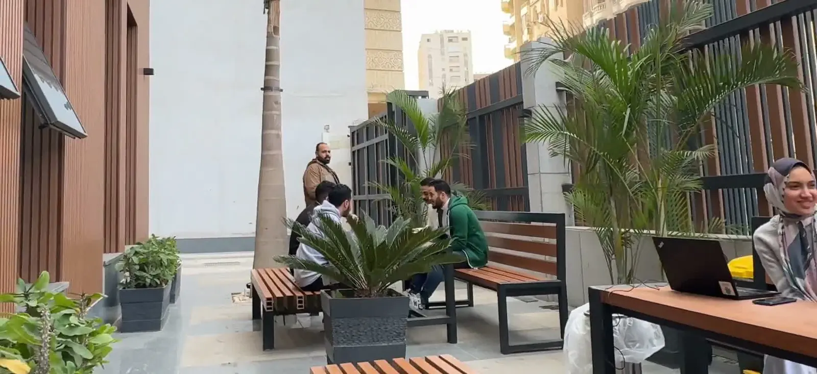 Colleagues talking on the outdoor terrace